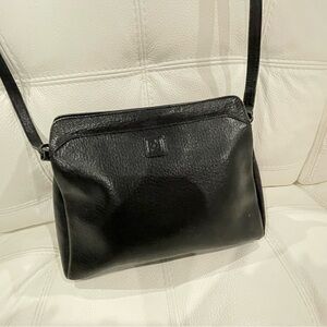 Authentic Lei Fendi leather handbag. Crossbody or use adjustable strap.
